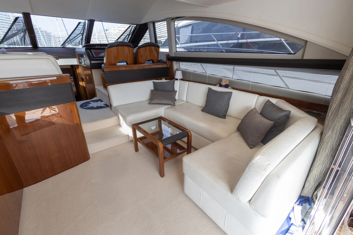 Luxurious interior of 2012 Princess 50 yacht with elegant seating and modern design.