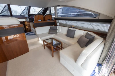 Luxurious interior of 2012 Princess 50 yacht with elegant seating and modern design.