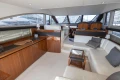 Luxurious interior of a 2012 Princess 50 yacht with elegant wood and leather furnishings.