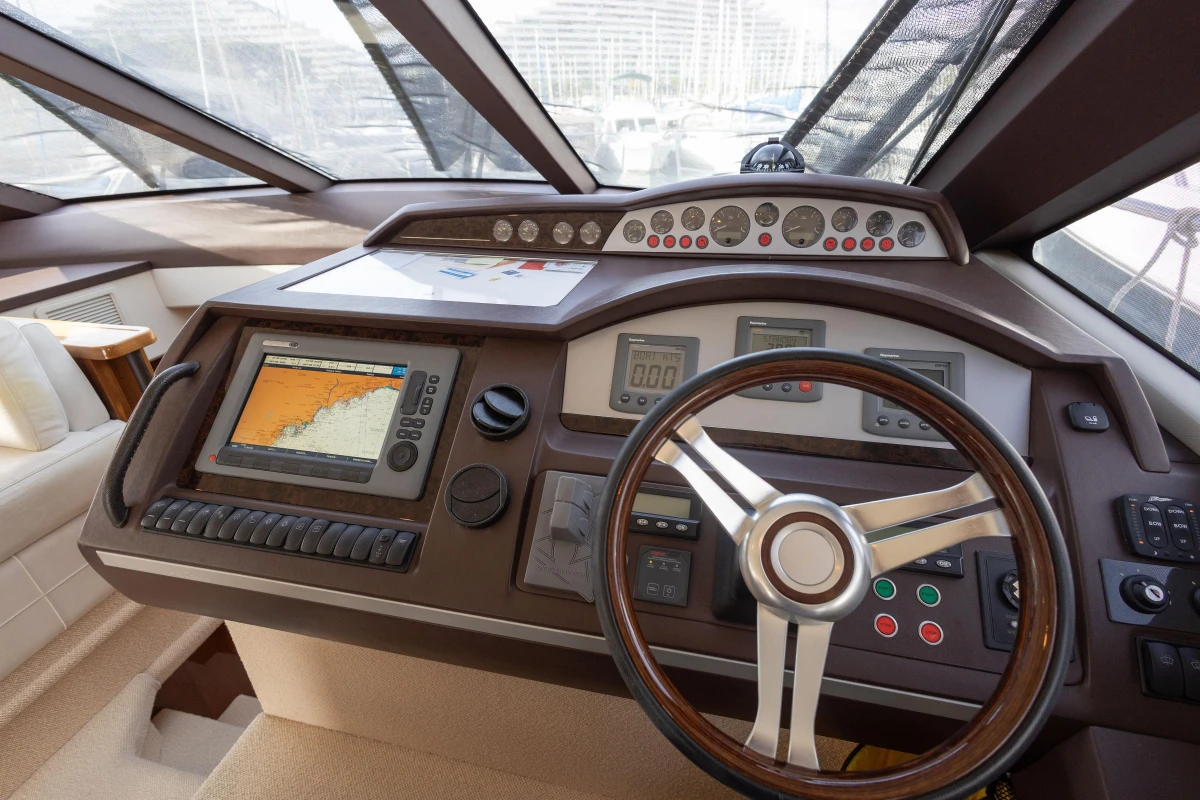 Helm of 2012 Princess 50 yacht with navigation controls and steering wheel.