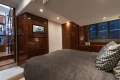 Luxurious cabin interior of 2012 Princess 50 yacht with modern furnishings and ambient lighting.