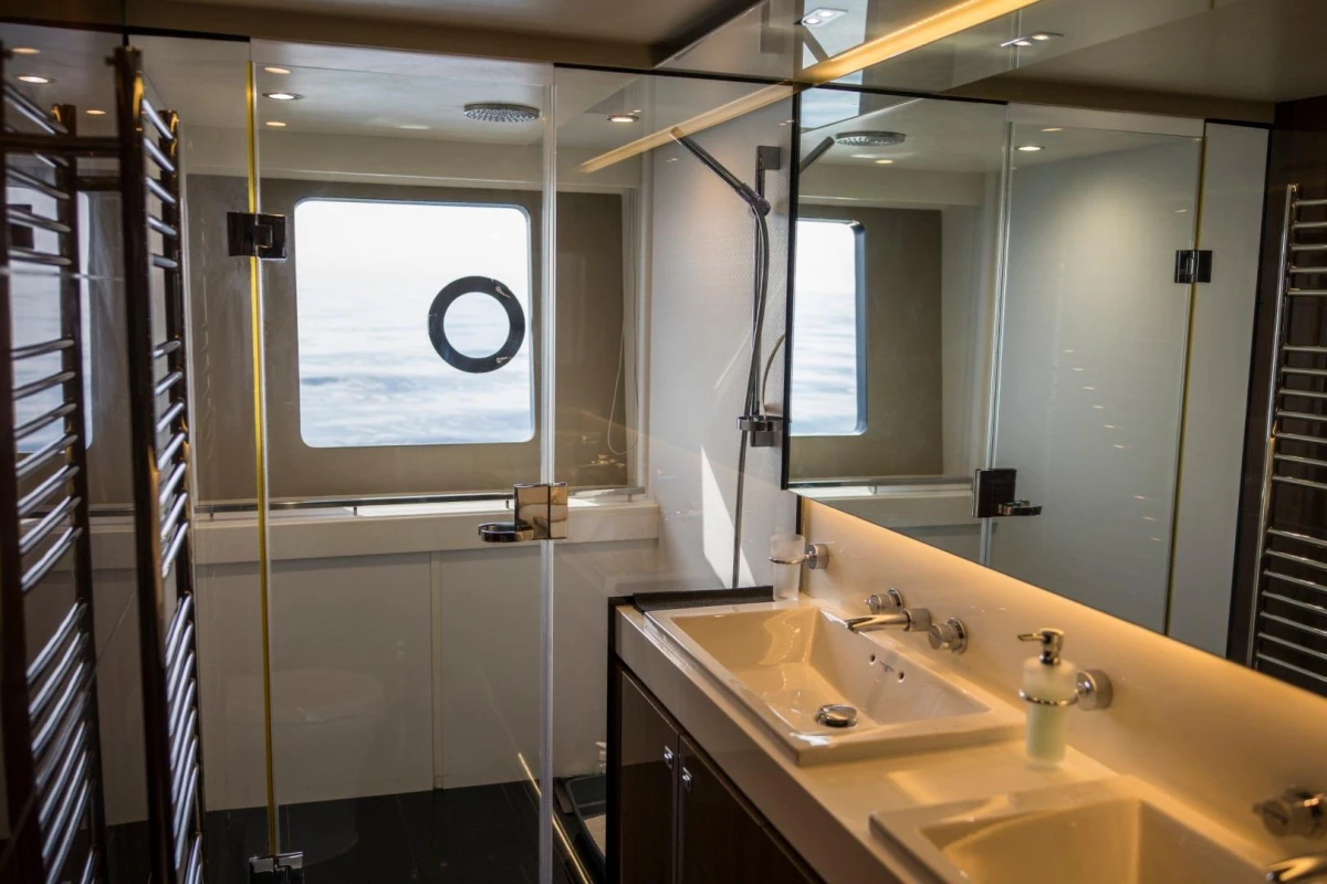 Luxurious bathroom on 2013 Princess 72 Motor Yacht with dual sinks and ocean view.