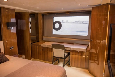 Luxurious interior of 2013 Princess 72 Motor Yacht with elegant wood finish and ocean view.