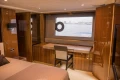Luxurious interior of 2013 Princess 72 Motor Yacht with elegant wood finish and ocean view.