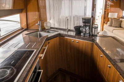 Luxurious kitchen interior of 2013 Princess 72 Motor Yacht with modern appliances.