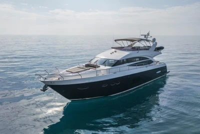 Luxurious 2013 Princess 72 Motor Yacht cruising on calm ocean waters.