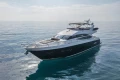Luxurious 2013 Princess 72 Motor Yacht cruising on calm ocean waters.