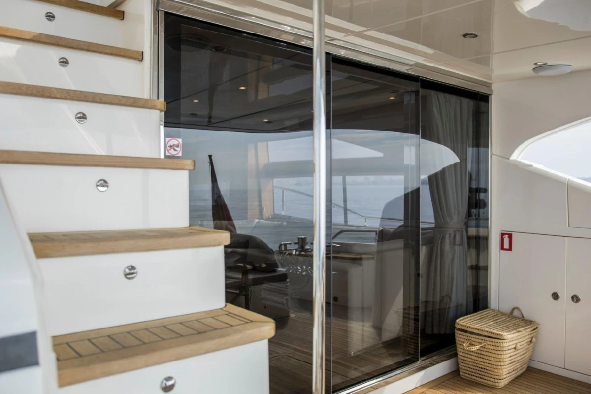 Staircase and glass doors on 2013 Princess 72 Motor Yacht, showcasing luxury interior.