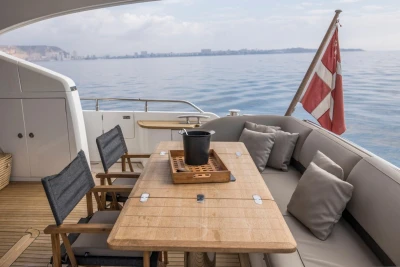 Luxurious 2013 Princess 72 Motor Yacht deck with seating, table, and ocean view.