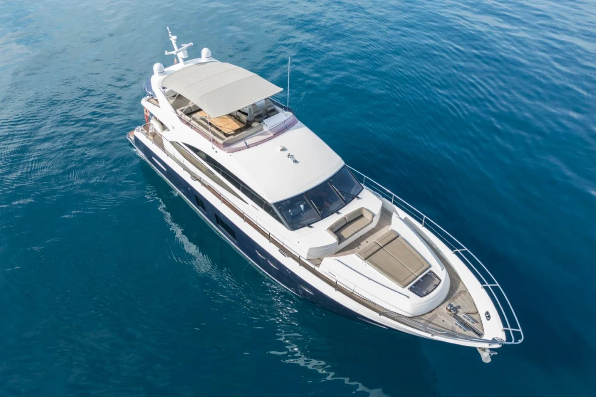 Aerial view of 2013 Princess 72 Motor Yacht on calm blue water.
