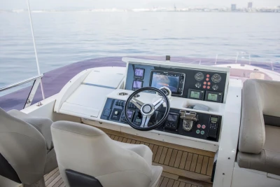 Helm of 2013 Princess 72 Motor Yacht with modern navigation controls and seating.