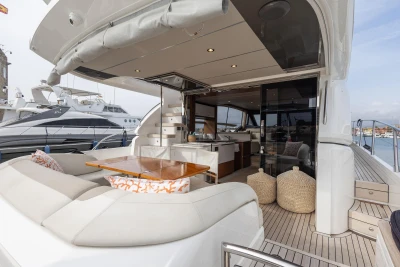 Luxurious 2020 Princess F62 yacht with elegant outdoor seating and modern interior design.