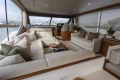 Luxurious interior of 2020 Princess F62 yacht with elegant seating and panoramic windows.