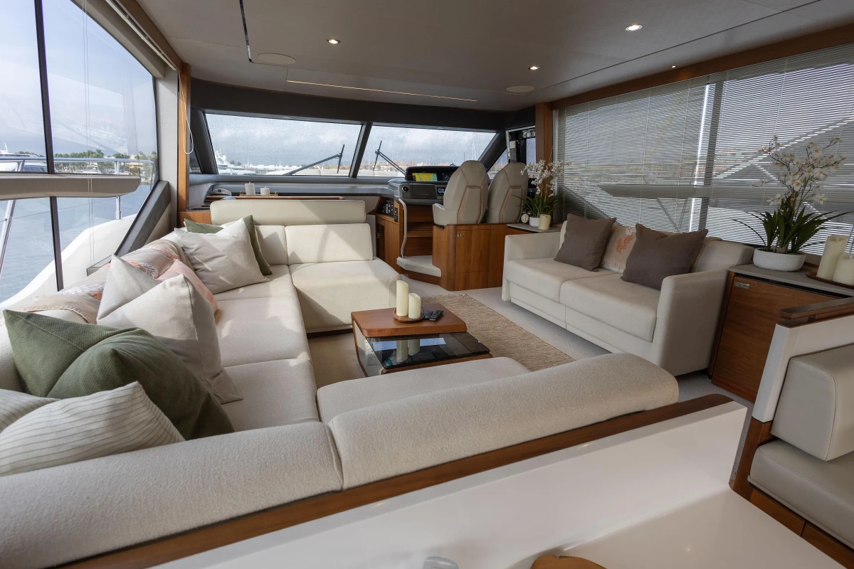 Luxurious interior of 2020 Princess F62 yacht with elegant seating and panoramic windows.
