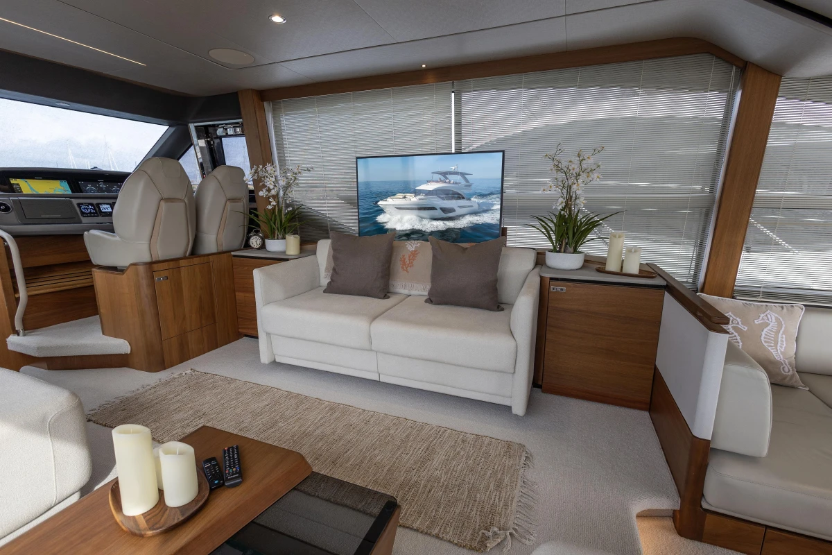Luxurious interior of 2020 Princess F62 yacht with modern decor and comfortable seating.