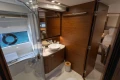 Luxurious bathroom interior of 2020 Princess F62 yacht with modern fixtures and wooden accents.