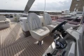Luxurious 2020 Princess F62 yacht deck with modern seating and steering controls.