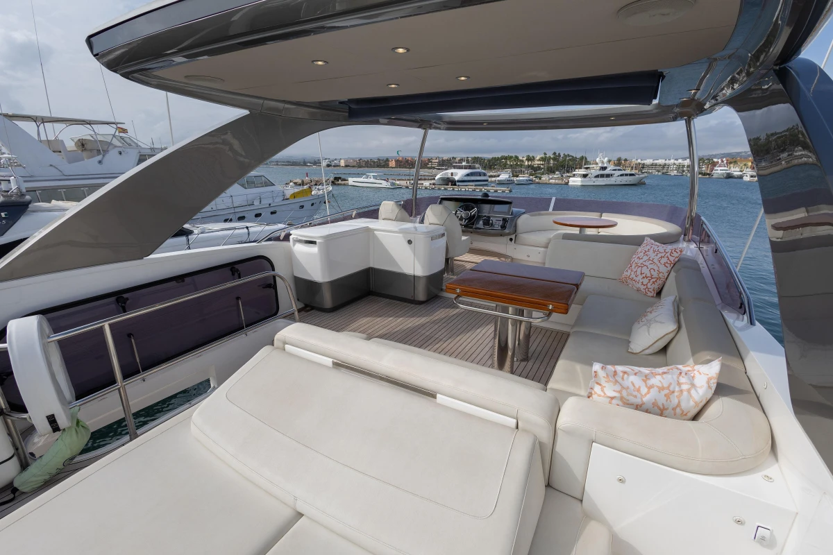 Luxurious 2020 Princess F62 yacht deck with elegant seating and ocean view.