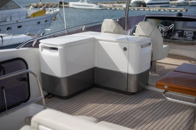 Luxurious 2020 Princess F62 yacht interior with modern seating and navigation controls.