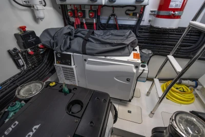 Engine room of 2025 Princess V50 yacht with equipment and wiring.