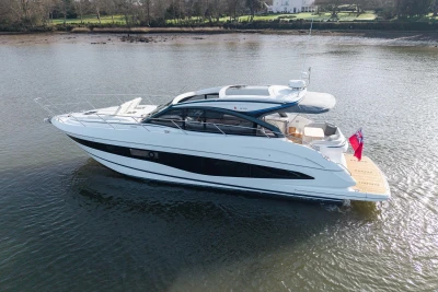 2025 Princess V50 yacht on calm water, showcasing sleek design and luxury features.