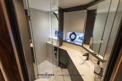 Luxurious bathroom interior of 2026 Princess S65 yacht with modern fixtures and elegant design.