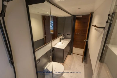 Luxurious bathroom interior of 2026 Princess S65 yacht, featuring modern fixtures and elegant design.
