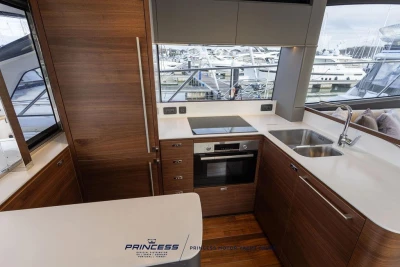 Luxurious kitchen interior of 2026 Princess S65 yacht with modern appliances and sleek design.