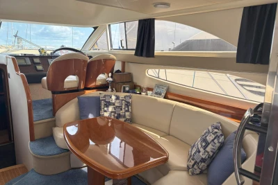 Luxurious interior of 2004 Princess 45 Flybridge Motor Yacht with elegant seating and helm.