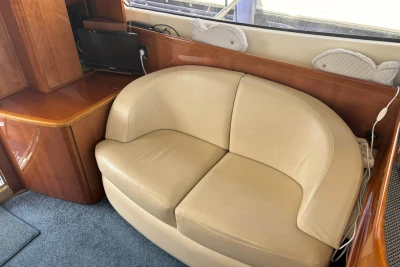 Luxurious interior of 2004 Princess 45 Flybridge Motor Yacht with beige leather seating.