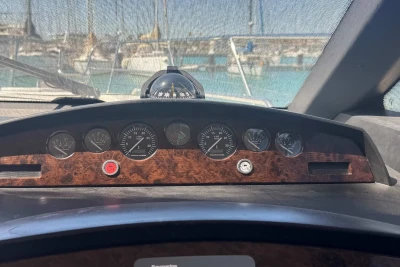 Dashboard of a 2006 Princess 42 yacht with gauges and compass.