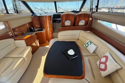 Luxurious interior of a 2006 Princess 42 yacht with elegant seating and decor.