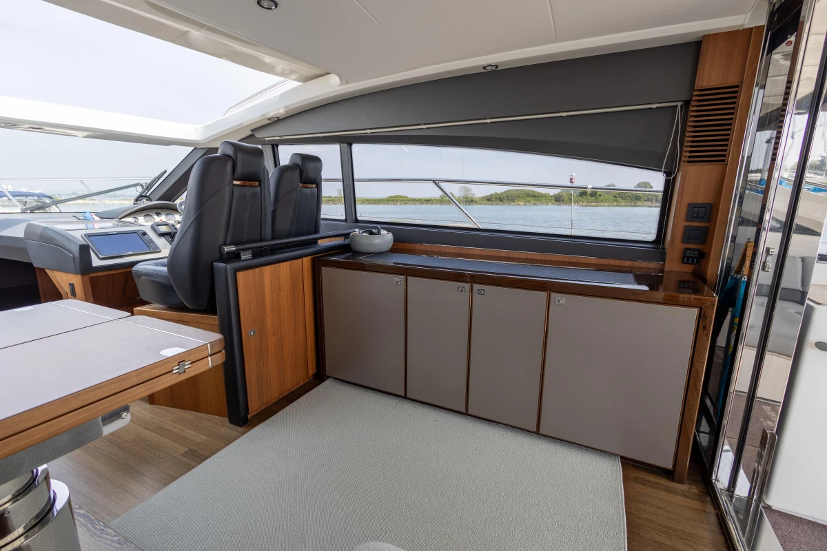 Interior of 2014 Princess V52 yacht with modern design and spacious seating area.