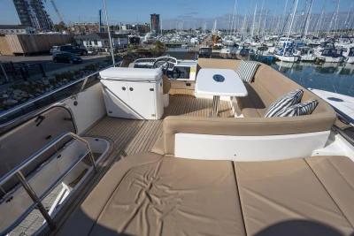 Luxurious 2009 Princess 54 yacht deck with seating and marina view.