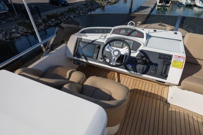 Helm of 2009 Princess 54 yacht with modern controls and navigation system.