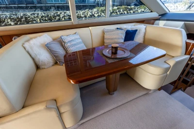 Luxurious 2009 Princess 54 yacht interior with elegant seating and decorative cushions.