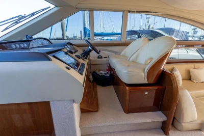 Interior of 2009 Princess 54 yacht with luxurious helm and seating area.