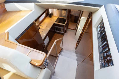 Luxurious interior of 2009 Princess 54 yacht featuring modern kitchen and control panel.