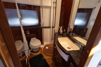 Luxurious bathroom in 2009 Princess 54 yacht with modern fixtures and elegant design.