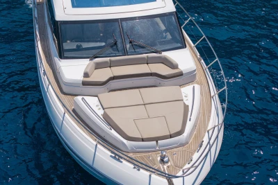 Luxury 2018 Princess S60 yacht with spacious sunbathing deck on blue ocean water.