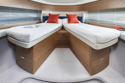 Luxurious twin cabin interior of 2023 Princess F45 yacht with modern design.