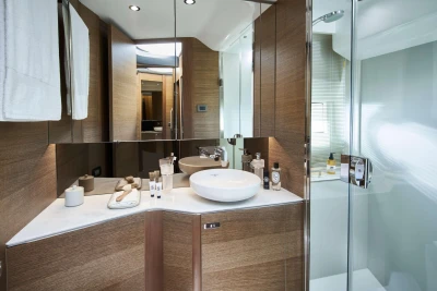 Luxurious bathroom in 2023 Princess F45 yacht with modern fixtures and elegant wood paneling.