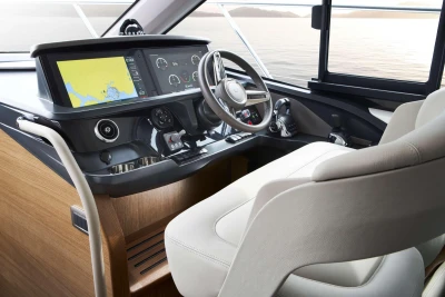 Interior of 2023 Princess F45 yacht cockpit with navigation display and controls.