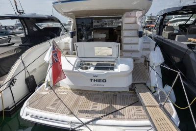 2023 Princess F45 yacht docked, featuring a spacious deck and elegant design.