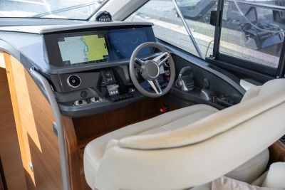Luxurious 2023 Princess F45 yacht helm with advanced navigation systems and plush seating.