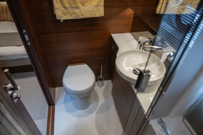 Luxurious bathroom in 2023 Princess F45 yacht with modern fixtures and wooden accents.
