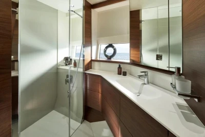 Luxurious bathroom in 2025 Princess F65 yacht with modern fixtures and elegant wood accents.
