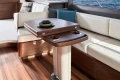 Luxurious interior of 2025 Princess F65 yacht with elegant wood and leather seating.