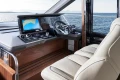 Luxurious 2025 Princess F65 yacht cockpit with advanced navigation system and plush seating.