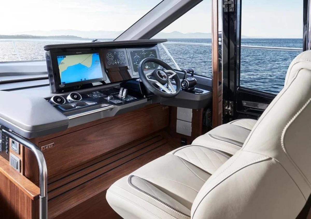 Luxurious 2025 Princess F65 yacht cockpit with advanced navigation system and plush seating.